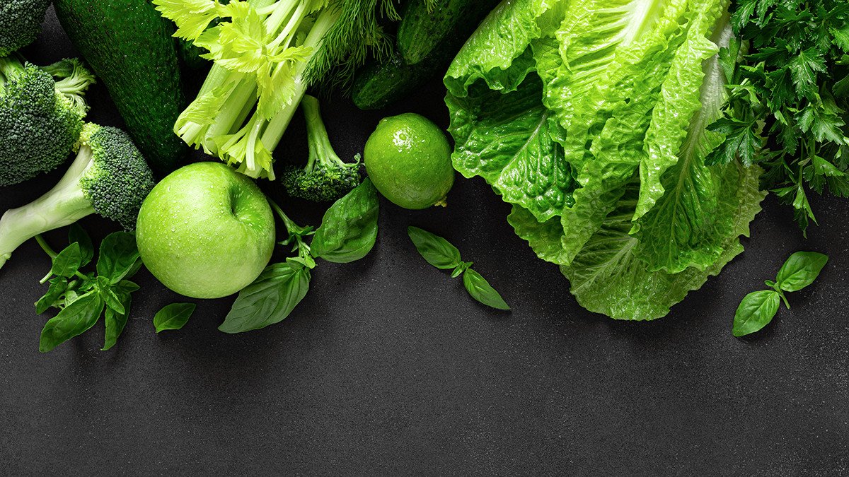 Healthy food, fresh raw green organic fruits and leafy vegetables, clean eating, vegetarian food concept background, top view