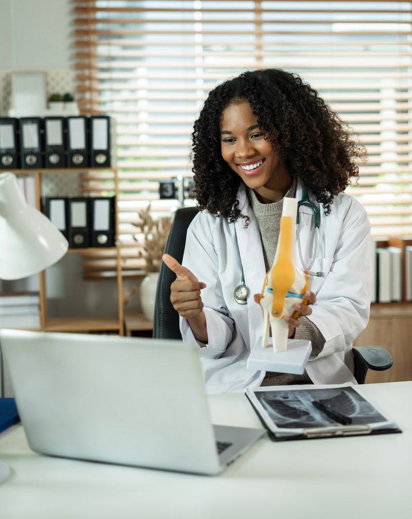 doctor speaking to patient on computer